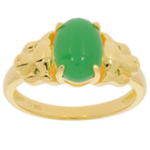Oval green jade ring in gold-tone setting, perfect for elegant styling and sophistication.